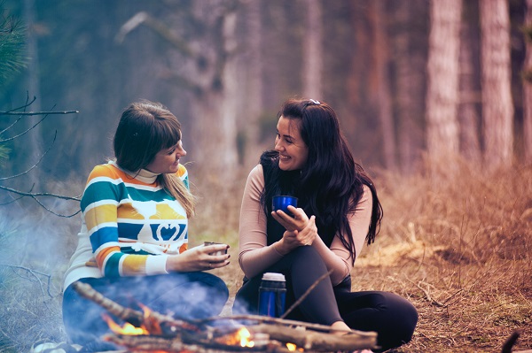 People sat around campfire